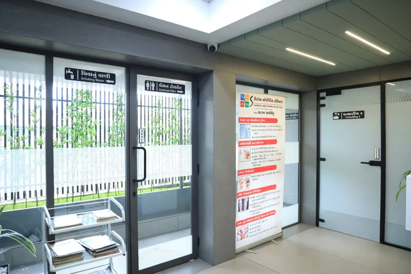 The ground floor corridor, signed in Gujarati and English